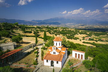 Fototapeta premium Sarantaporo village, church near the village aerial vie, Greece