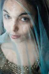 Photo of young woman through the wet cloth