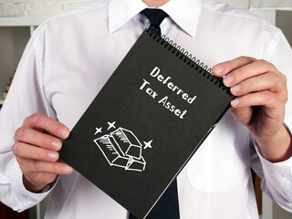 Financial concept meaning Deferred Tax Asset with sign on the sheet.