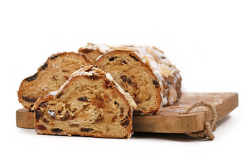 German Stollen cake, a fruit bread with nuts, spices, and dried or candied fruits with powdered...