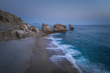 Triopetra beach, cliffs on Crete in a turquoise sea