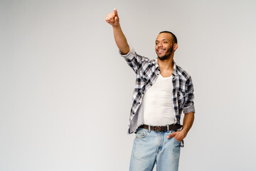 Young african american man pressing or pushing button on virtual screen