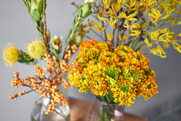 Set of yellow nd orange flowers for Interior decorations. The work of the florist at a flower shop. Fresh cut flower. European floral shop. Delivery fresh cut flower