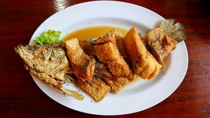 Deep fried sea bass with fish sauce called 