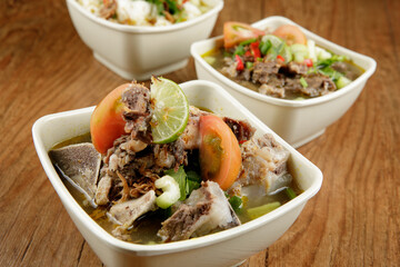Delicious Beef soup shoot on wooden table