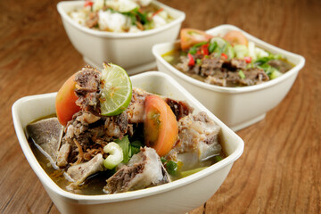 Delicious Beef soup shoot on wooden table