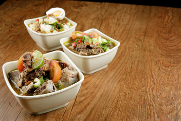 Delicious Beef soup shoot on wooden table
