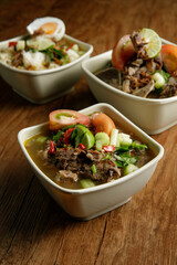 Delicious Beef soup shoot on wooden table