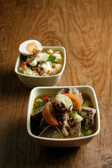 Delicious Beef soup shoot on wooden table