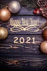Happy new year 2021 on wooden brown background
