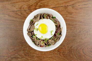 Delicious Korean food Bulgogi Rice serve in white bowl