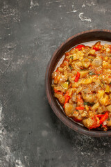 top view roasted eggplant salad in bowl on dark background with free space