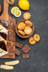 top view cake slices with chocolate and cookies on dark background dessert pie cakes sweet