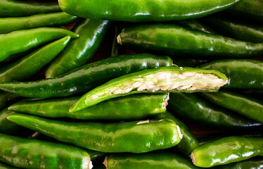 View of green chilies in a bowl. Green chilies commonly used in Asian cuisine.