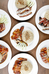 flat lay of chicken rice, pork rice and roasted duck rice