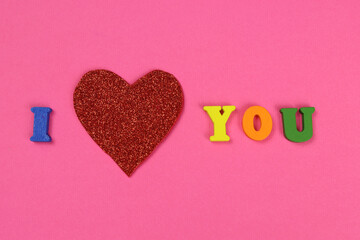 heart with the inscription I love you pink background