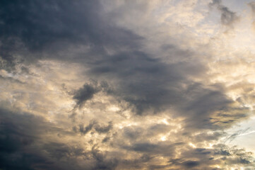 Naklejka na ściany i meble a dramatic cloudy sky in the dark autumn time
