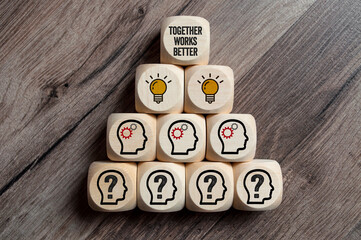 Cubes, dice or blocks and dice with teamwork and together works better on wooden background