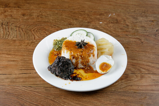 Nasi kukus daging kicap, popular traditional Malay local food.
