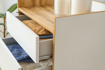 Modern chest of drawers in room