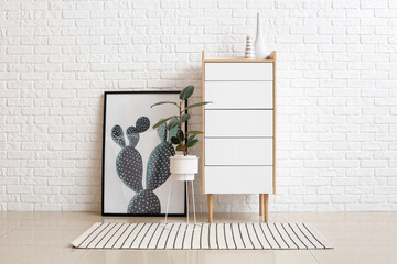 Modern interior of living room with chest of drawers