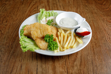 a plate of fish and chip set come with french fries and coleslaw