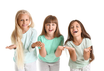 Obraz premium Emotional little girls in pajamas on white background