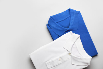 New male shirts on light background