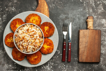 top view fried cutlets with cooked rice on a dark background dish meat rissole