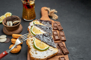 front view delicious cake slices with chocolate on dark background cake sweet dessert