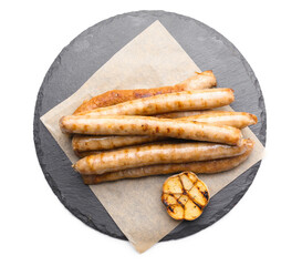 Slate plate with delicious grilled sausages on white background