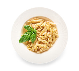 Plate with tasty pasta and pesto sauce on white background