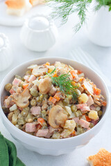 Olivier with champignons, Russian salad with vegetables and mushrooms, selective focus