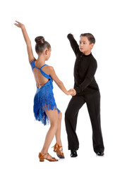 Cute little children dancing against white background