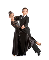 Cute little children dancing against white background