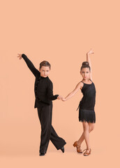 Cute little children dancing against color background