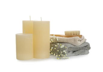 Aroma candles with bathing supplies on white background