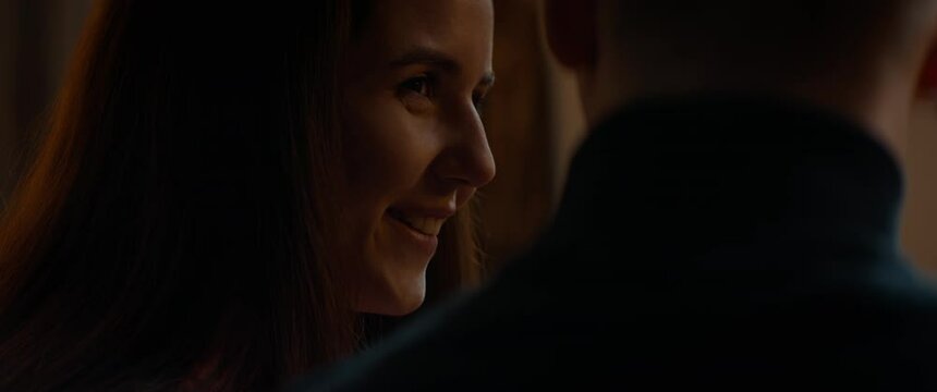 Teenagers sitting close to each other, having an intimate moment, first kiss. Hesitate, love, teen life. Shot with 2x anamorphic lens