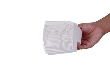 Hand holding Napkins stack isolated on white background.