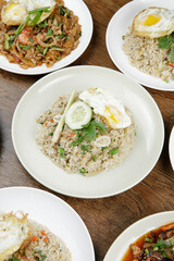 a plate of fried rice with fried egg