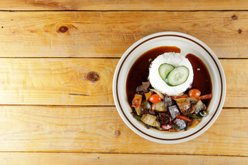 a plate of white rice with mutton soy sauce