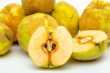 Quince fruit close-up on a white background.