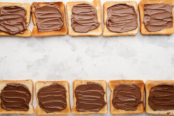 Top view of bread toast with with chocolate-nut paste spread with place for text