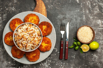 top view fried cutlets with cooked rice on the dark background dish meat rissole
