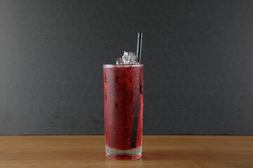 a glass of ice red syrup