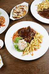 a plate of chicken grill set come with french fries and coleslaw