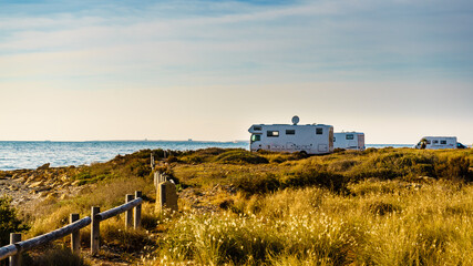 Camper cars on beach sea shore