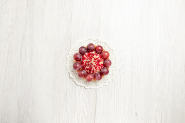 top view delicious cake with grapes on white background dessert biscuit pie