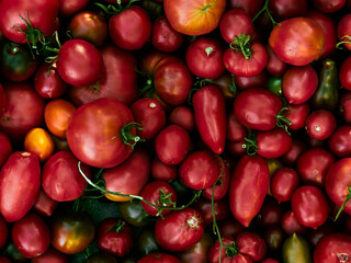 Background with ripe red tomatoes..