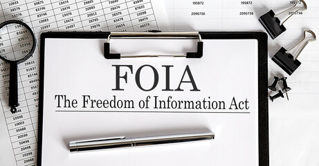 Paper with The Freedom of Information Act FOIA on a table